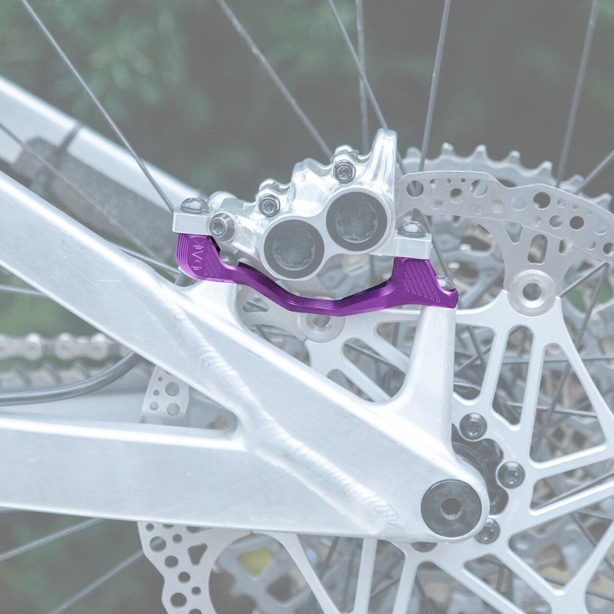 OAK Components OAK Components Plasmadapt Brake Adapter Purple, PM +40/43mm - $45.00 at Backcountry.com