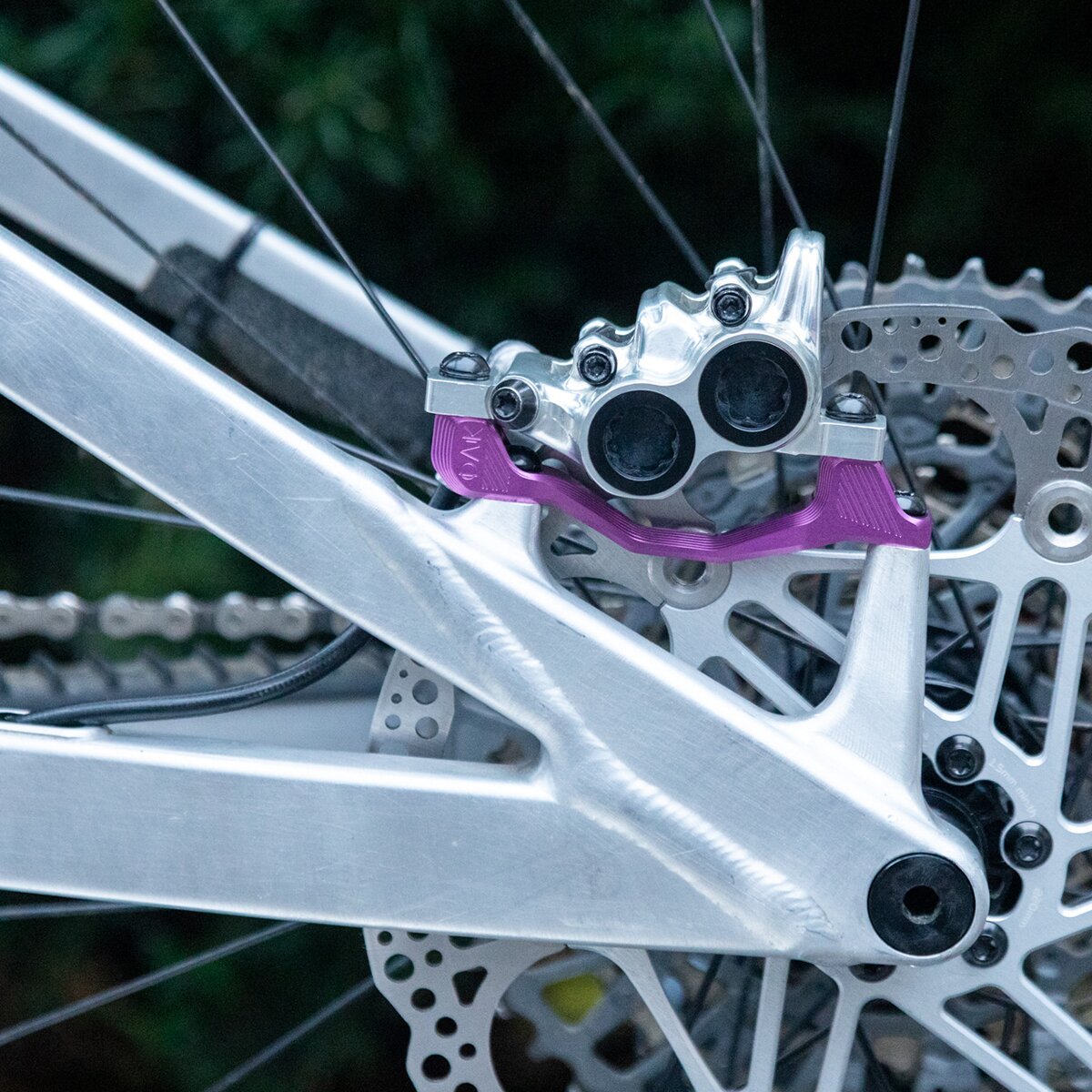 Image of OAK Components Plasmadapt Brake Adapter Purple, PM +23mm