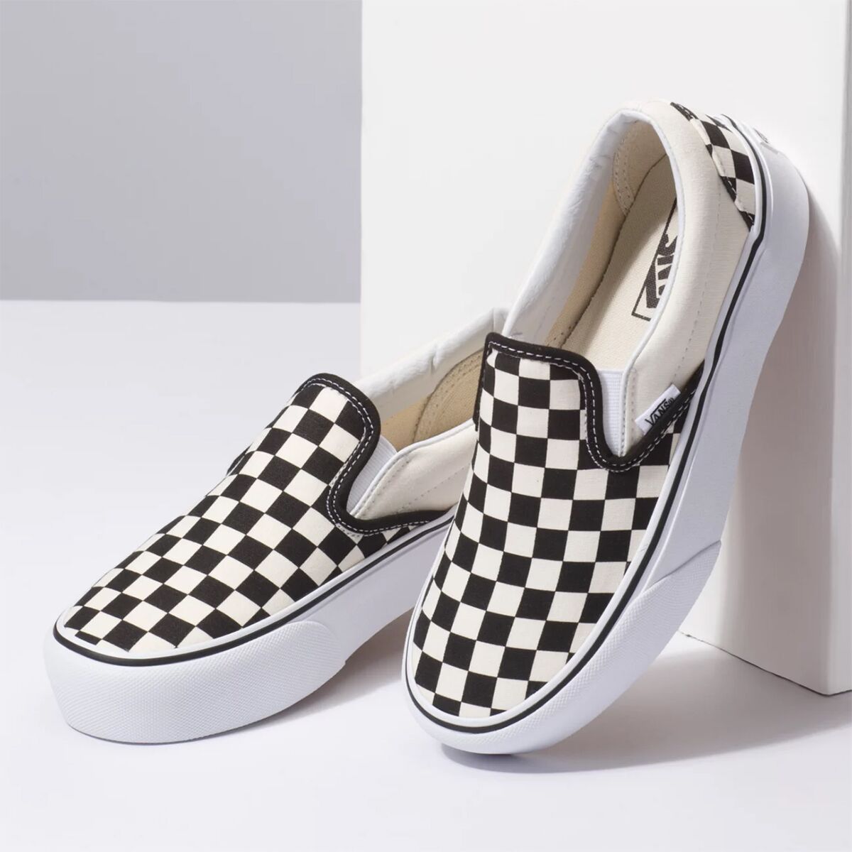 black checkered slip ons