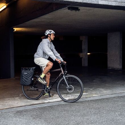 Cyclist carrying a rear pannier bag